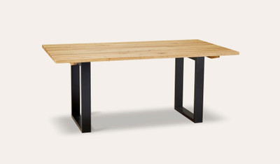 Eden dining table in sustainable Australian messmate timber with sleek modern edges and black detailing, contemporary timber dining table