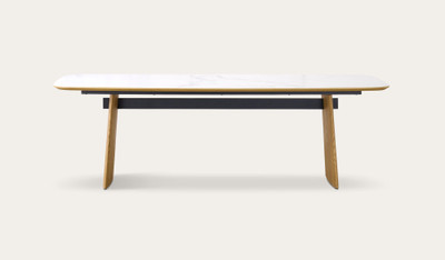 Cara dining table with matte white carrara-look ceramic top and natural oak finish, modern rectangular dining table