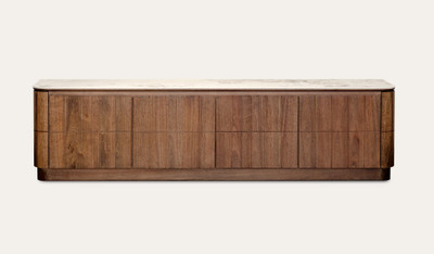 Montera buffet with a glossy marble-look sintered stone top and umber timber cabinetry, combining statement design with practical dining storage.