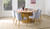 Denmark round dining table in natural oak with matte clear finish and slatted timber legs, modern timber dining table