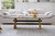 Cara coffee table with matte white carrara-look ceramic top and natural oak finish, contemporary round coffee table