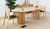 Carrera dining table in Tasmanian oak timber with fluted detailing, curved silhouette, and natural water-based finish, modern timber dining table