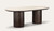 Armano dining table with travertine ceramic top and dark oak panelled base, bold modern timber dining furniture