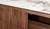 Montera buffet with a glossy marble-look sintered stone top and umber timber cabinetry, combining statement design with practical dining storage.