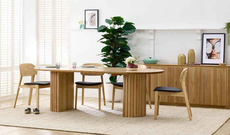 Carrera dining table in Tasmanian oak timber with fluted detailing, curved silhouette, and natural water-based finish, modern timber dining table