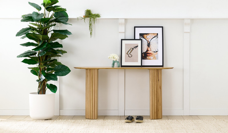 Carrera hall table in Tasmanian oak timber with fluted detailing, curved silhouette, and natural water-based finish, modern timber console table