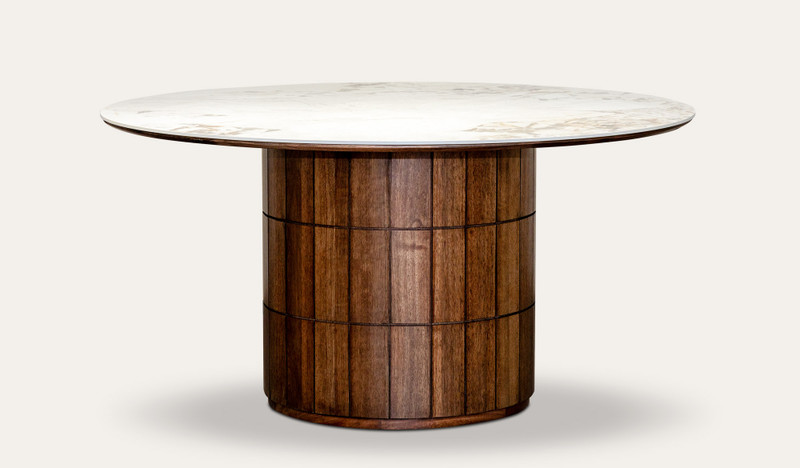 Montera round dining table featuring a glossy marble-look sintered stone top with warm umber timber base, creating a bold and refined centrepiece for modern dining spaces.