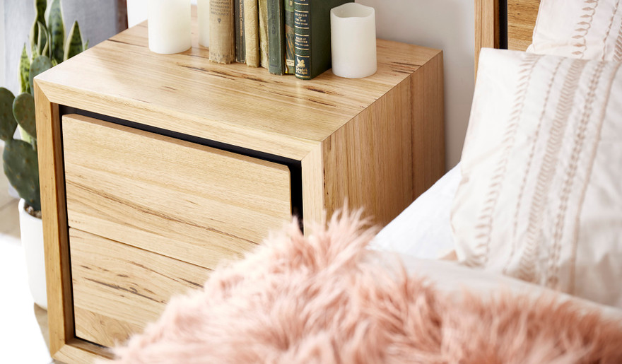 Eden bedside table in sustainable Australian messmate timber with sleek modern edges and black detailing, contemporary timber bedside table
