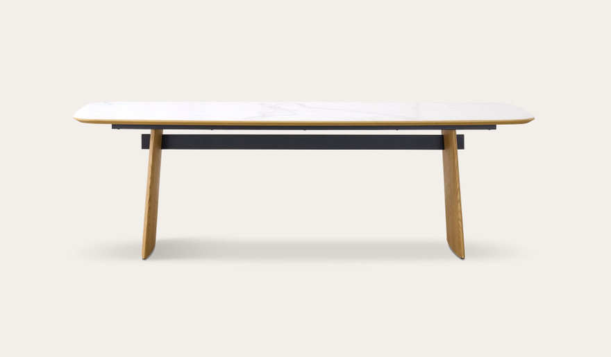 Cara dining table with matte white carrara-look ceramic top and natural oak finish, modern rectangular dining table