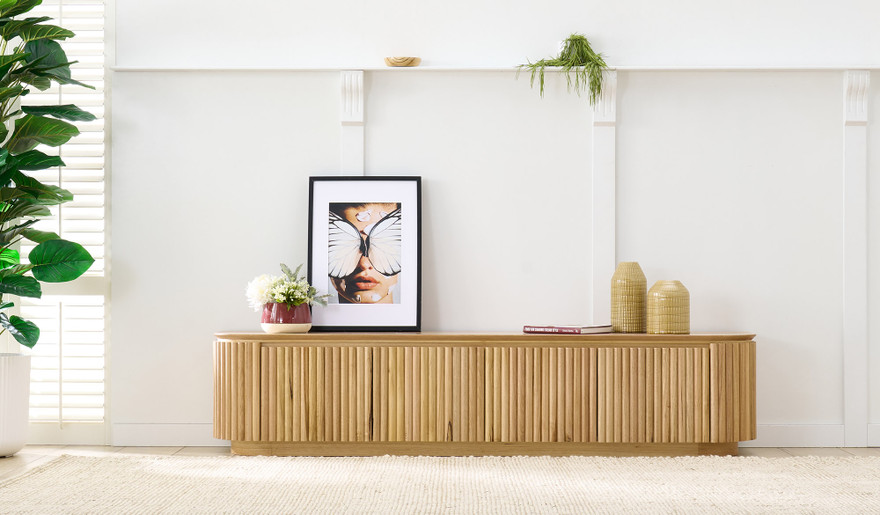 Carrera entertainment unit in Tasmanian oak timber with fluted detailing, curved silhouette, and natural water-based finish, modern timber TV cabinet