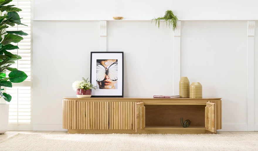 Carrera entertainment unit in Tasmanian oak timber with fluted detailing, curved silhouette, and natural water-based finish, modern timber TV cabinet