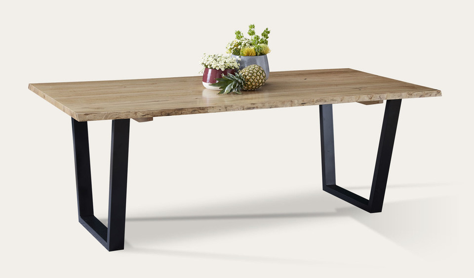 Archie dining table in solid messmate timber with live edge detail and black metal legs, modern timber dining table