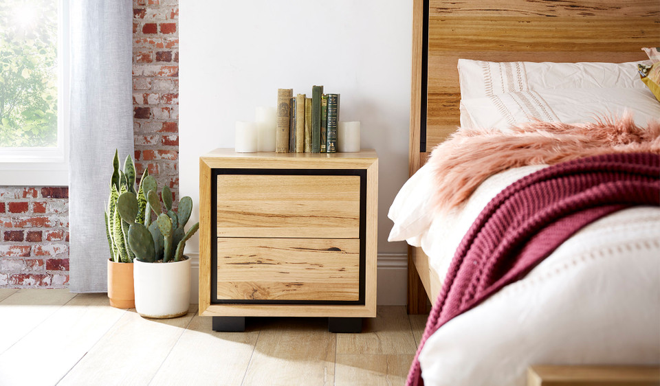 Eden bedside table in sustainable Australian messmate timber with sleek modern edges and black detailing, contemporary timber bedside table