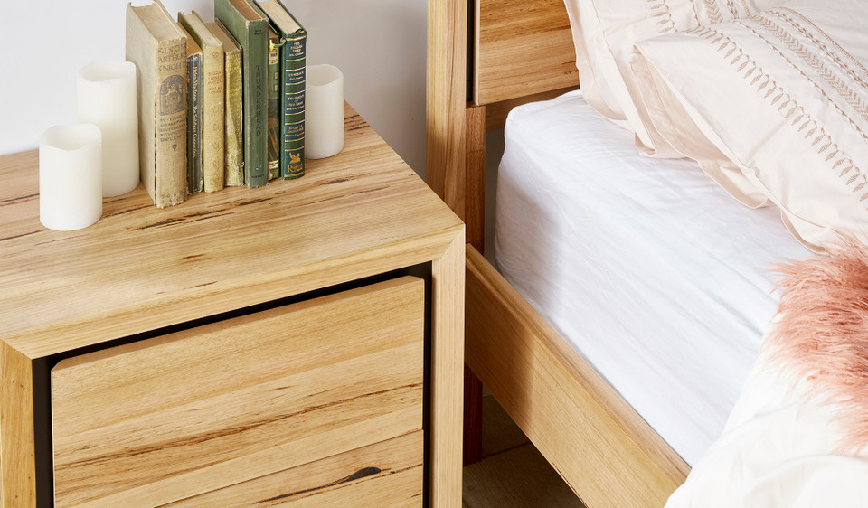 Eden bedside table in sustainable Australian messmate timber with sleek modern edges and black detailing, contemporary timber bedside table