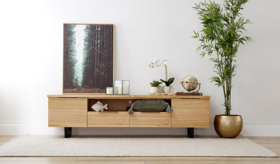 Braxton entertainment unit in solid messmate timber with black metal legs and multiple storage compartments