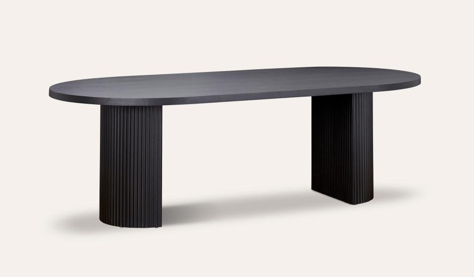 Eclipse black dining table with distinct sculptural base and modern design, creating a sophisticated and timeless statement for the dining room