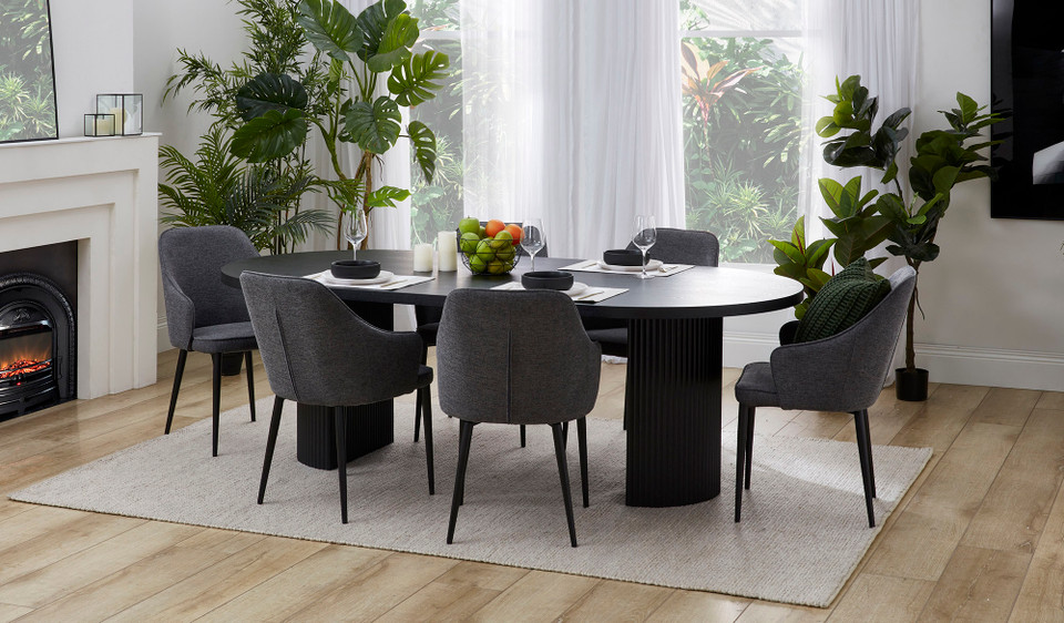 Eclipse black dining table with distinct sculptural base and modern design, creating a sophisticated and timeless statement for the dining room