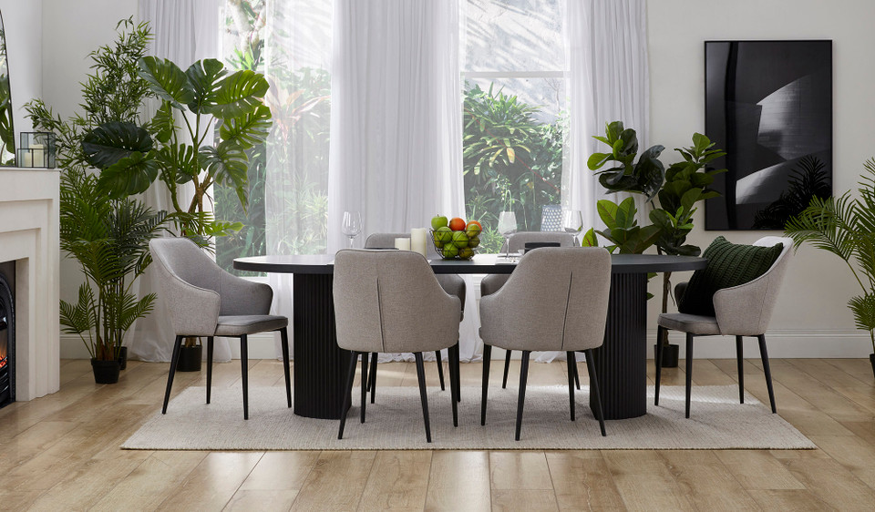 Eclipse black dining table with distinct sculptural base and modern design, creating a sophisticated and timeless statement for the dining room