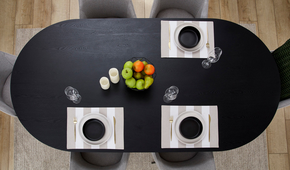 Eclipse black dining table with distinct sculptural base and modern design, creating a sophisticated and timeless statement for the dining room