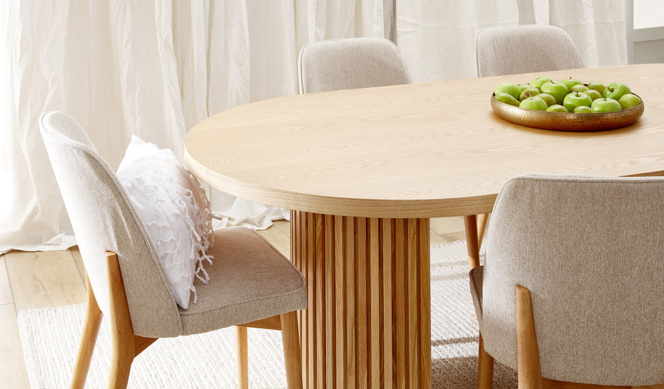 Eclipse natural ash dining table with distinct sculptural base and modern design, creating a sophisticated and timeless statement for the dining room