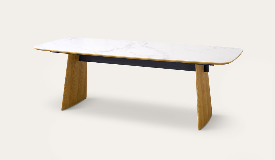 Cara dining table with matte white carrara-look ceramic top and natural oak finish, modern rectangular dining table