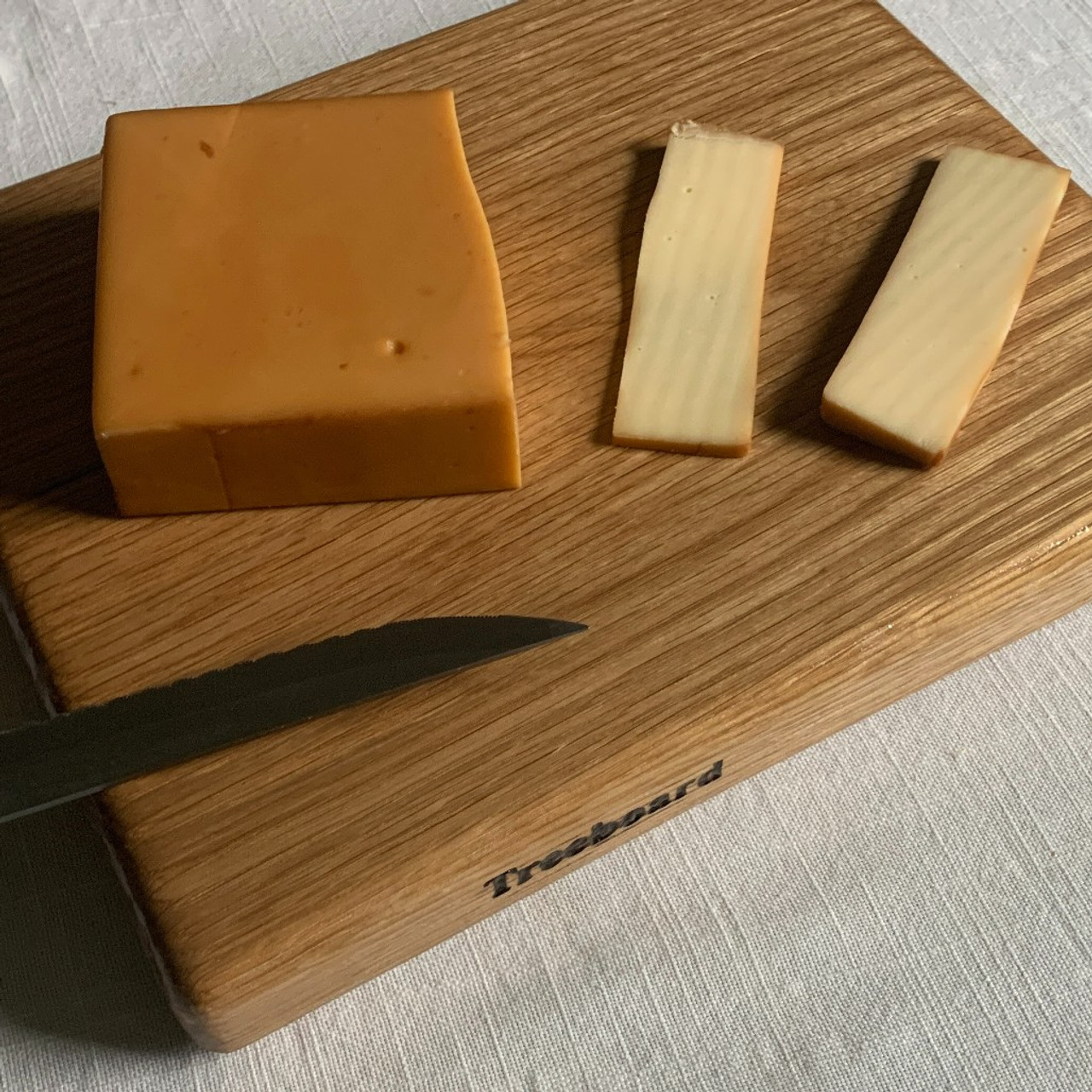 https://cdn11.bigcommerce.com/s-1vey7r6116/images/stencil/1280x1280/products/130/497/small-white-oak-cutting-board-by-Treeboard-knife-cheese__89054.1669344772.jpg?c=1