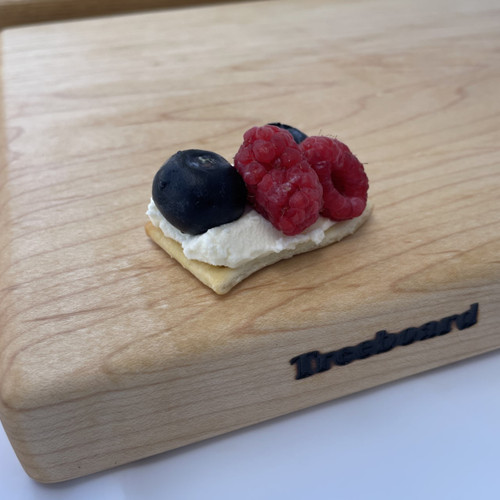 Medium maple cutting board by Treeboard with raspberries and blueberries and mascarpone
