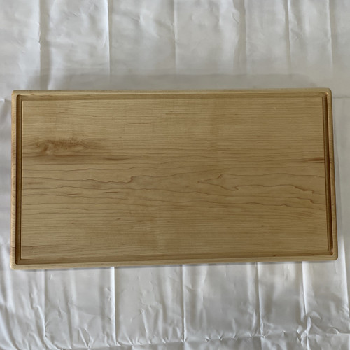 Large hard maple cutting board by Treeboard with juice groove.
