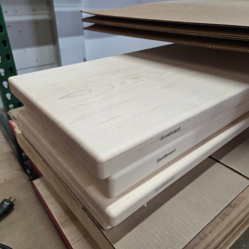 Stack of hard maple cutting boards by Treeboard.