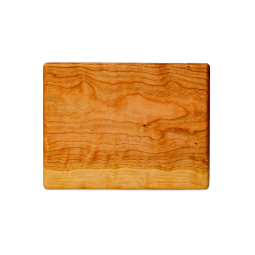 Small cherry chopping board by Treeboard. These cutting boards are organic, made of one piece of wood with no glue or petroleum products.