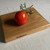 Small white oak cutting board by Treeboard with tomato