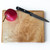 Small hard maple chopping board by Treeboard with knife and red pear.