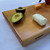 Large black cherry serving board and cutting board or cheese board by Treeboard with goat cheese, or chevre, avocado.
