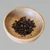 Black pepper corns in a handmade oak spice bowl by Treeboard.