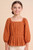 Girl's Rust Eyelet Pleat Detail Peplum Top