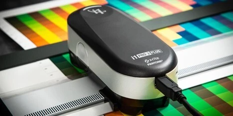 The i1Pro3 spectrophotometer measuring a color test chart