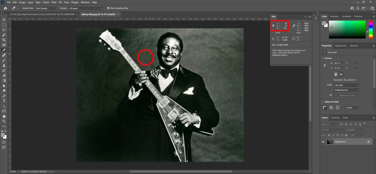 An image open in Photoshop with the Info panel displaying the Lab value of a gray area in the file