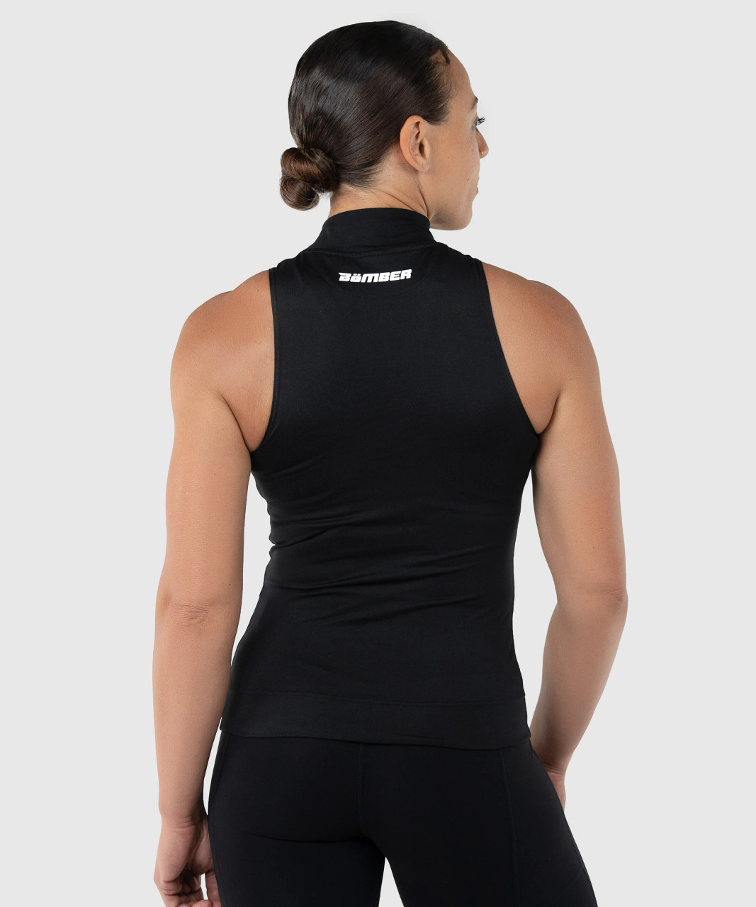 Thrive Tank, women's black performance tank with silicone Bomber back yoke logo, back view