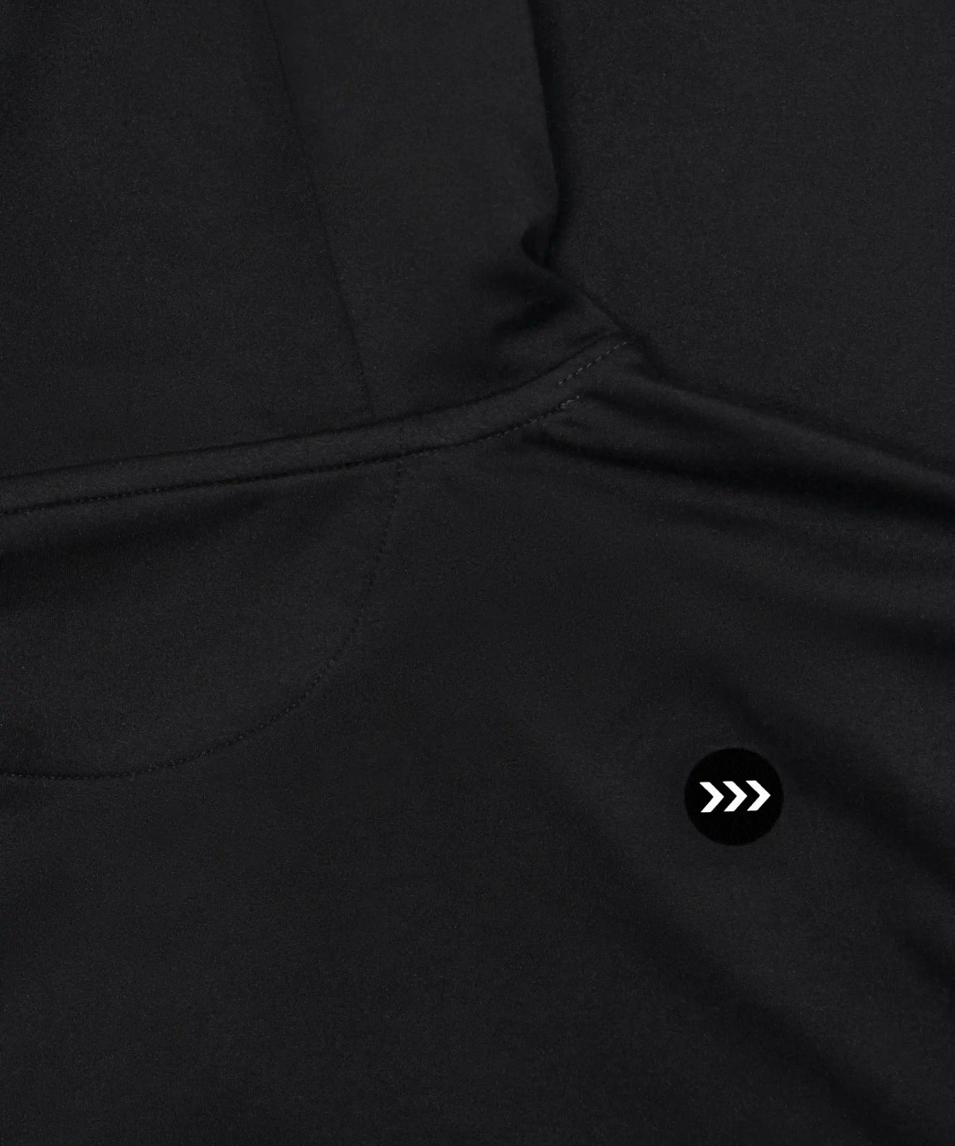 Ascend Hoodie, black stretch nylon performance hoodie with silicone Bomber chest logo, close-up view