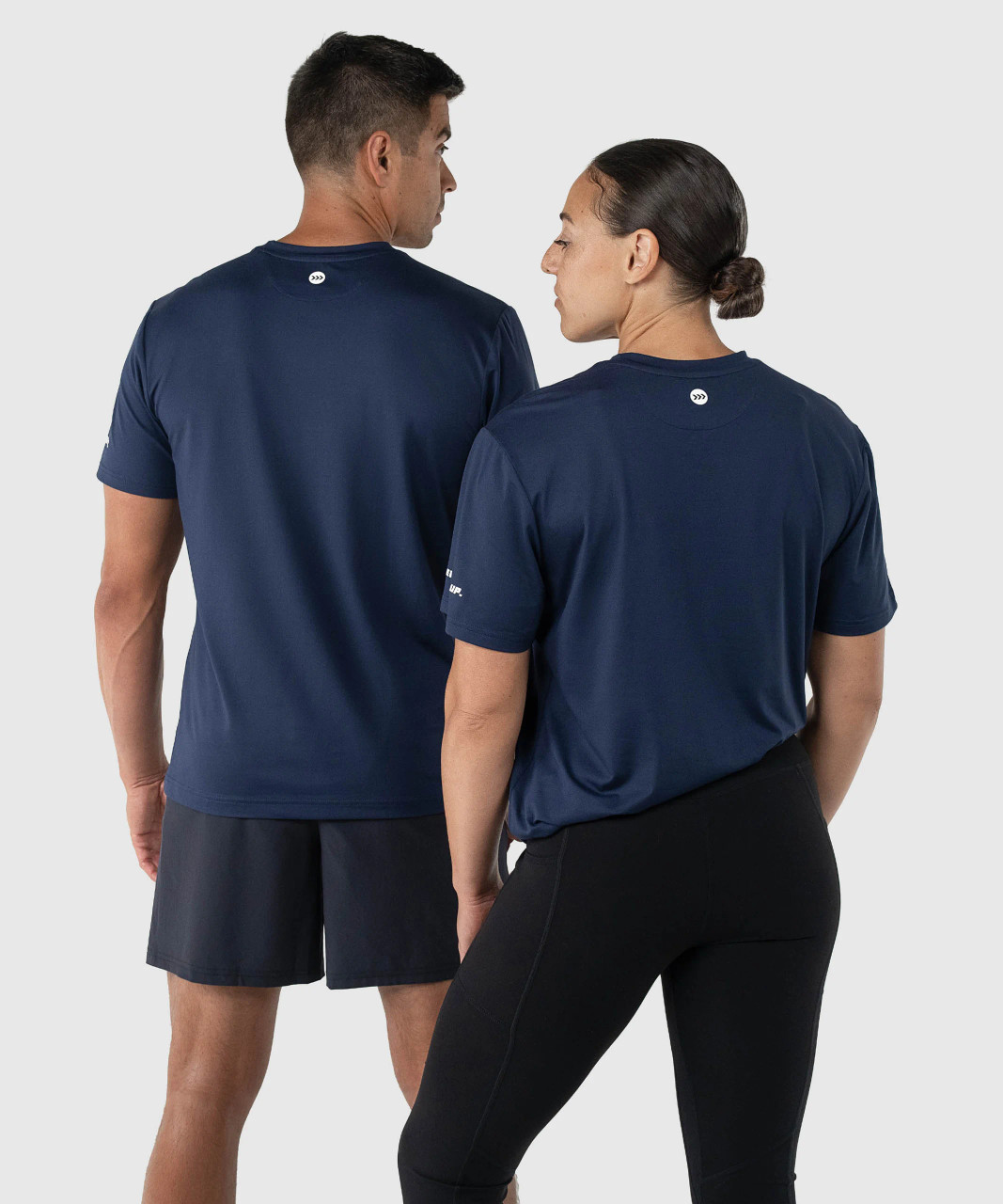 Ignite T-Shirt, navy unisex performance t-shirt with silicone Bomber back yoke logo, back view