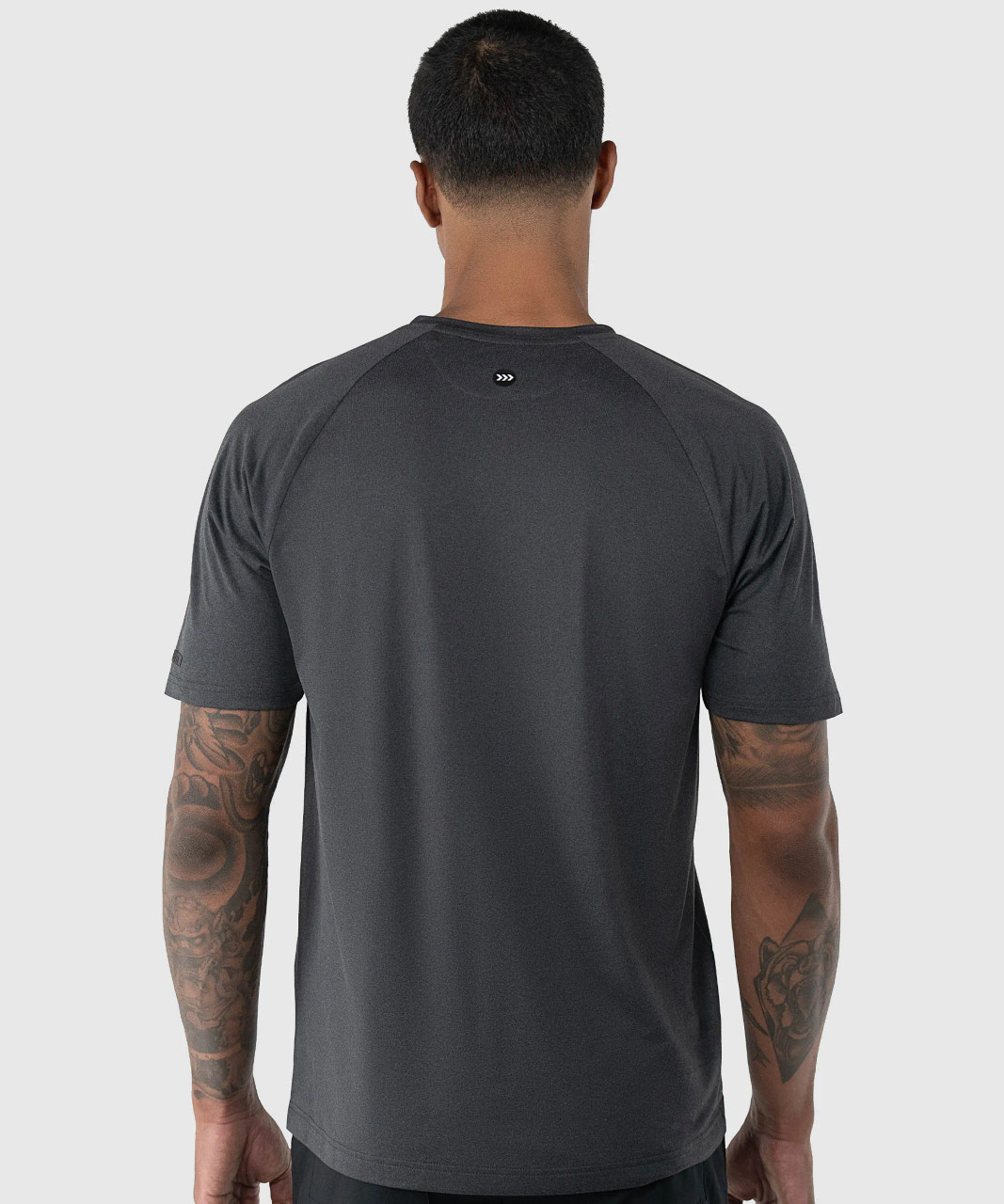 Elevate T-Shirt, men's black heather performance t-shirt with silicone Bomber back yoke logo, back view