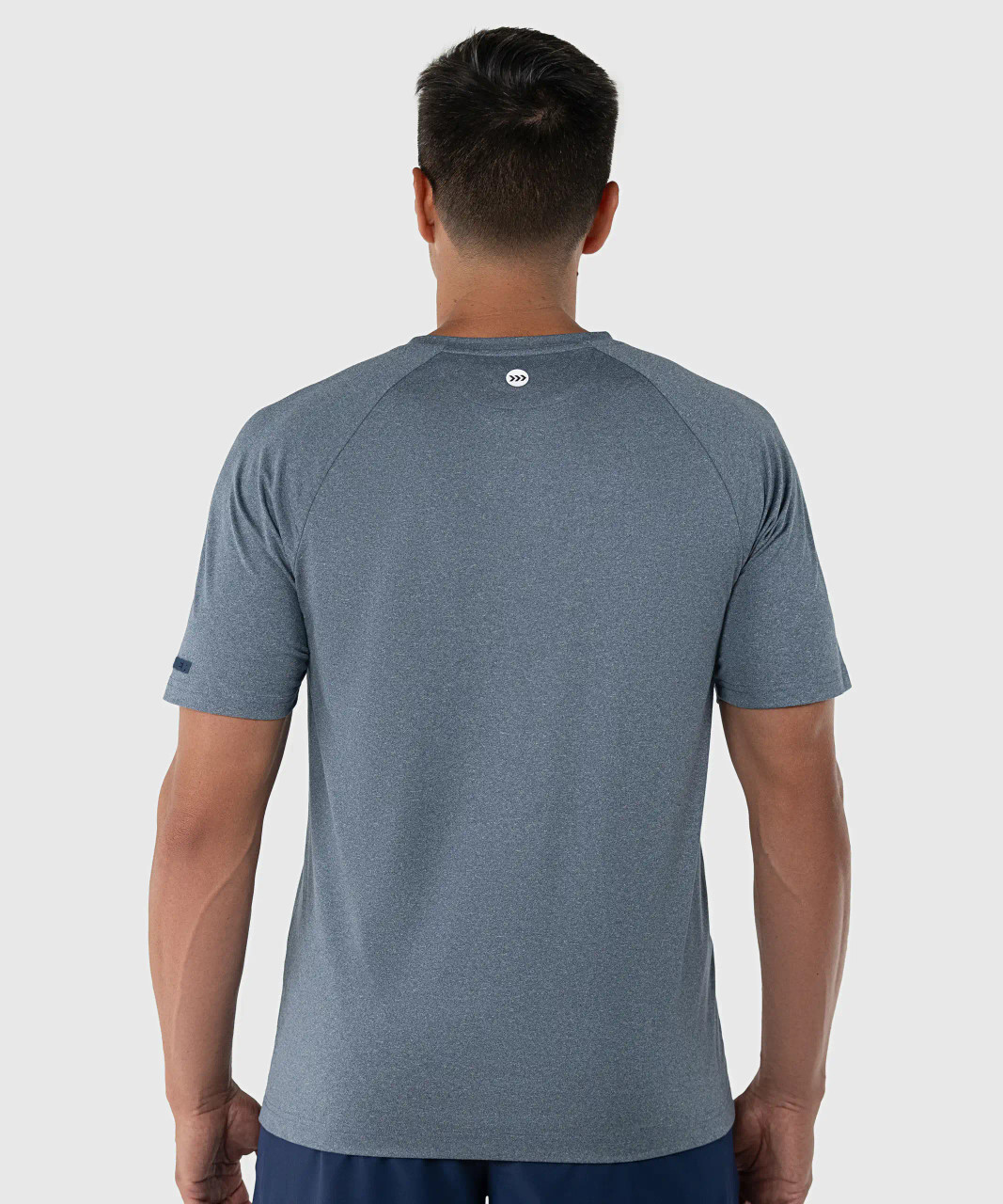 Elevate T-Shirt, men's navy heather performance t-shirt with silicone Bomber back yoke logo, back view