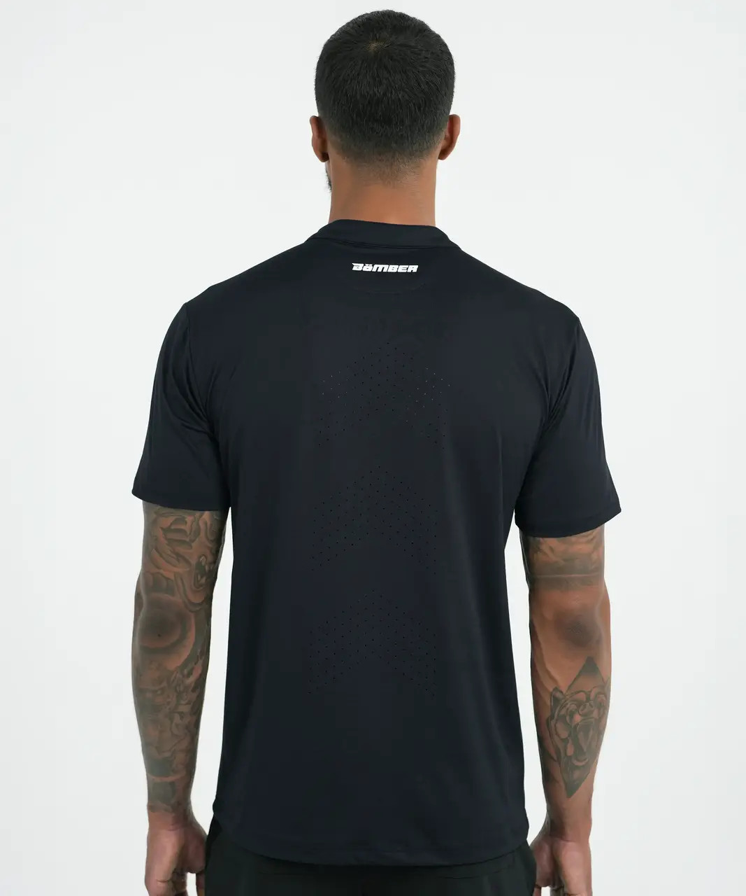 Core MB Polo, men's black performance polo with Apex-shaped back ventilation, back view