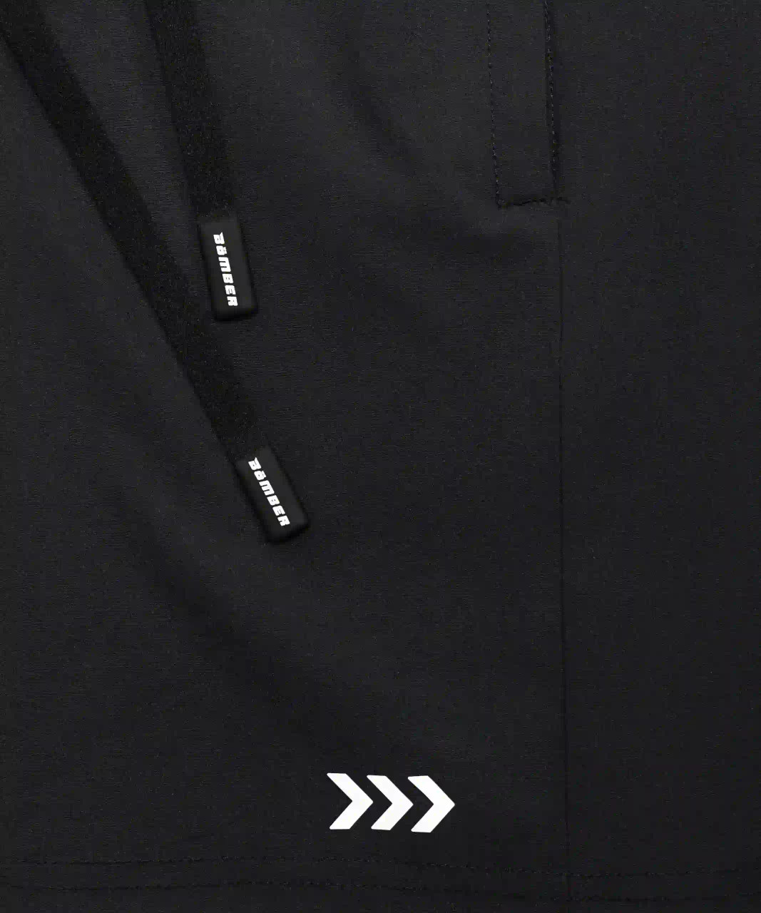 Focus Active Short, black breathable stretch performance fabric with heat transfer logo, close-up view