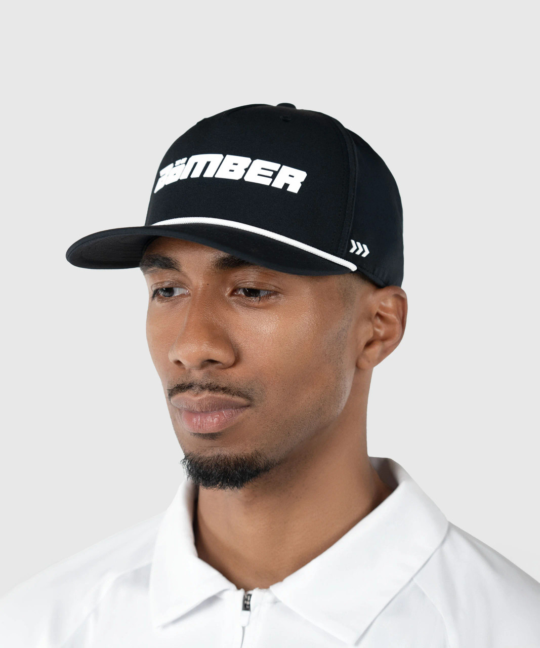 Ambition Snapback, black high-crown structured snapback with rope detail worn by model, lifestyle view