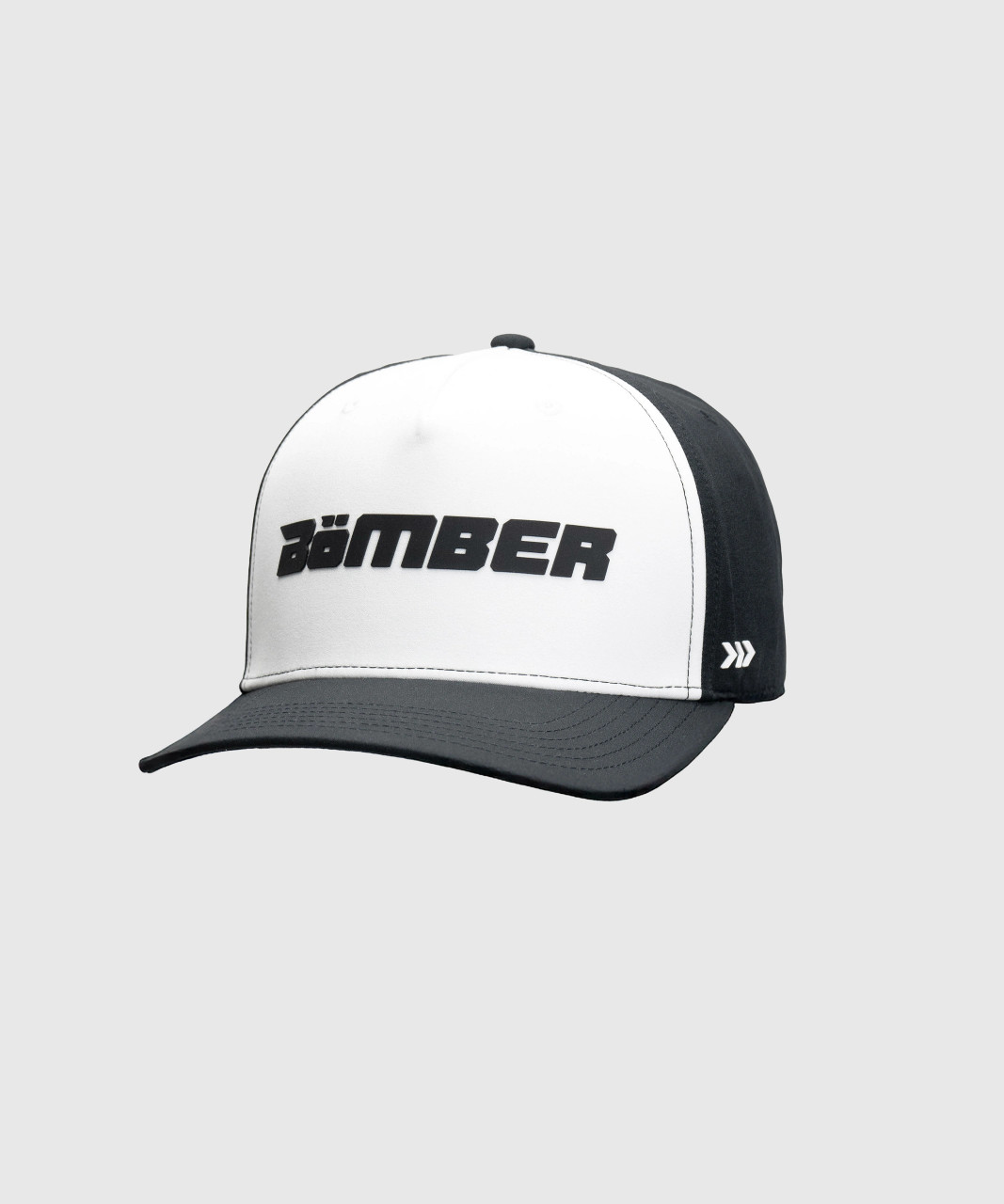 Method Snapback, black and white high-crown structured snapback hat with silicone Bomber logo, front view