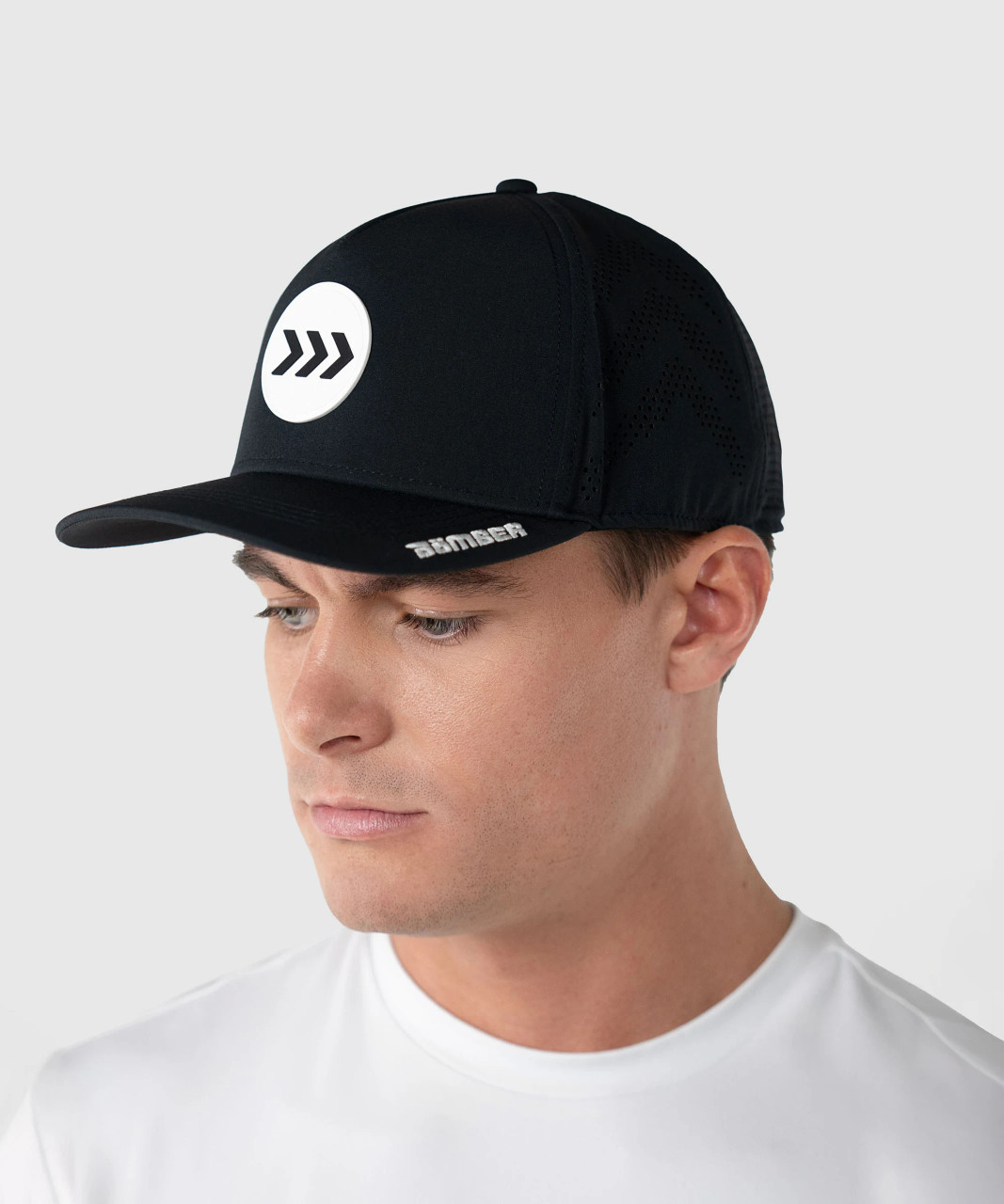 Impact Snapback, black high-crown structured snapback worn by model, lifestyle view