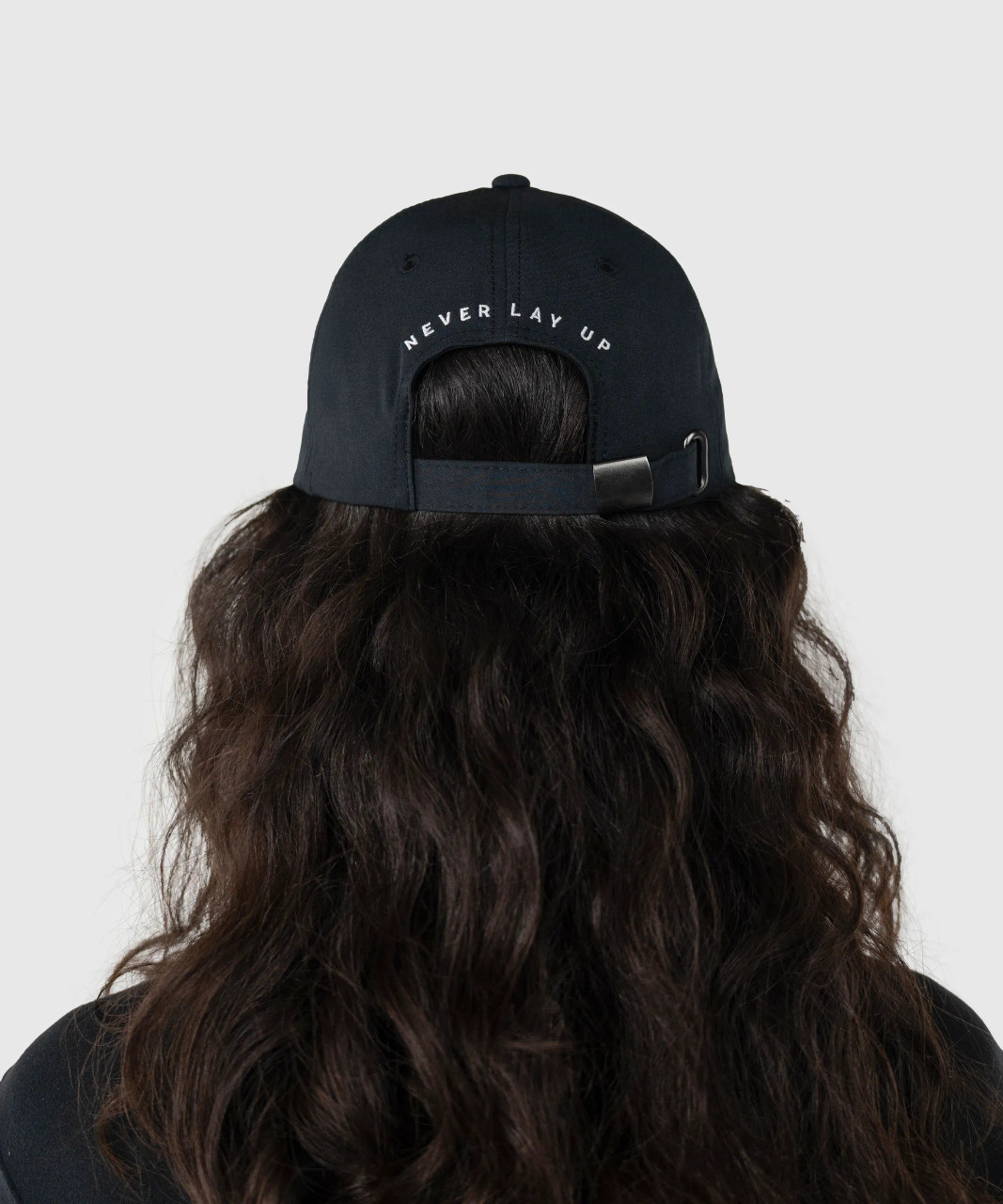 Radiance Hat, black performance hat worn by woman, back view