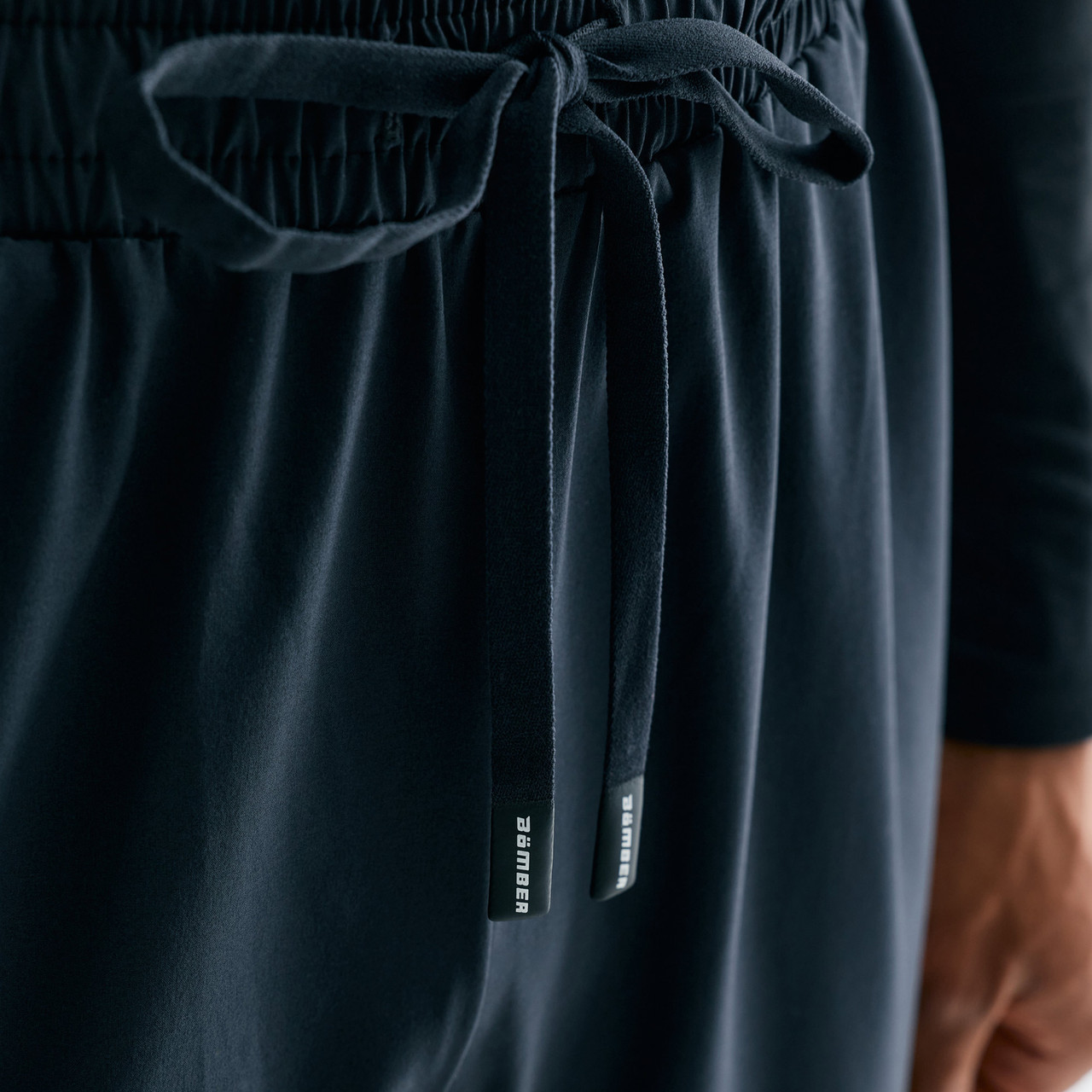 Surpass Pant, men's black jogger pants, close-up waistband and drawstring detail