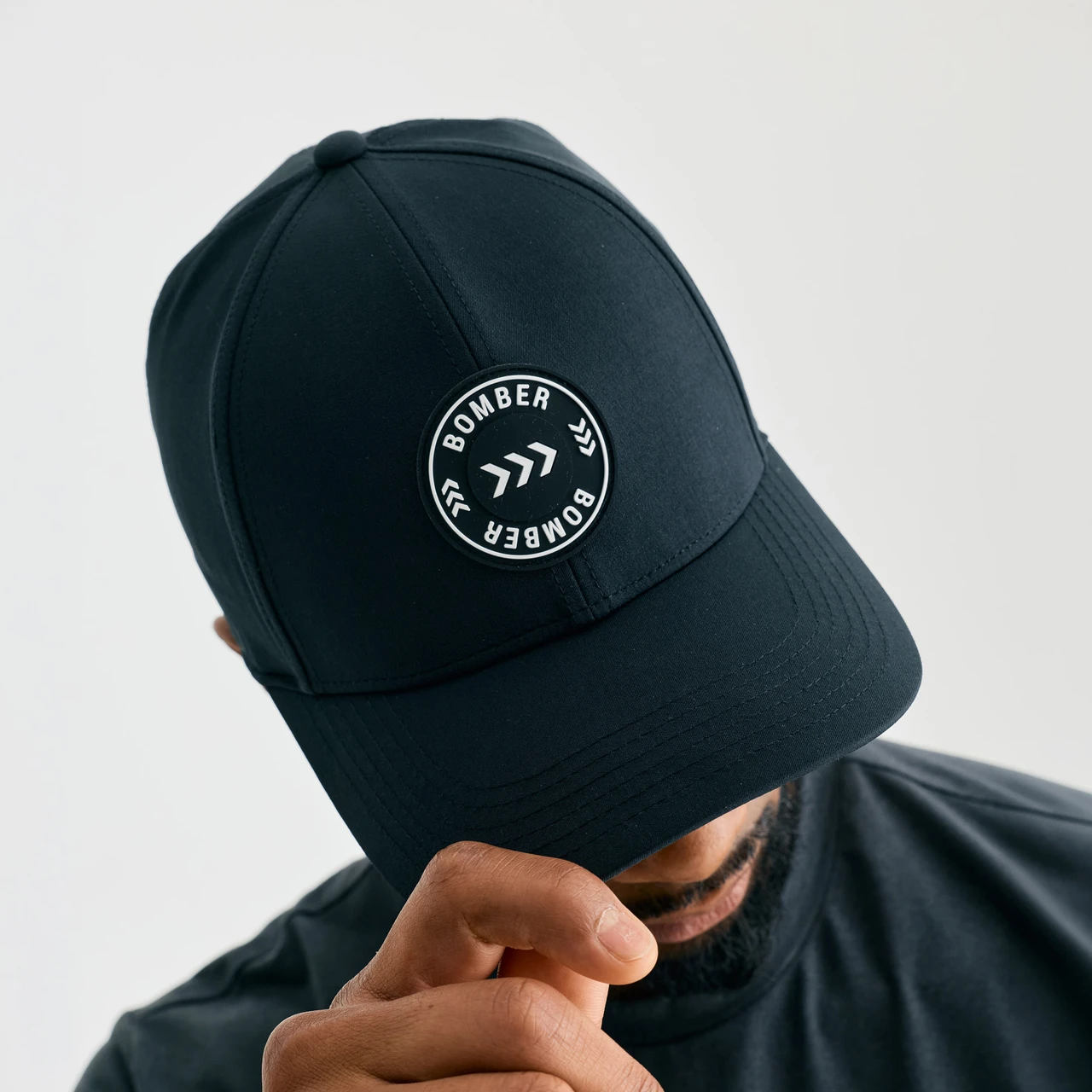 Zone Snapback, men's black snapback hat, close-up front view